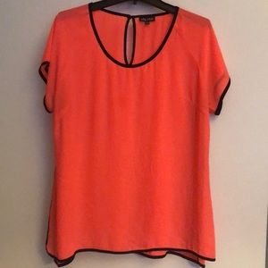 Sheer bright pink top with black panel sides.